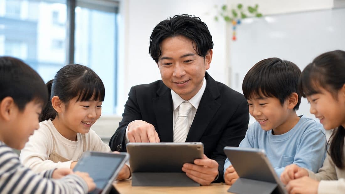 タブレットでAIを学ぶ子どもたちと講師